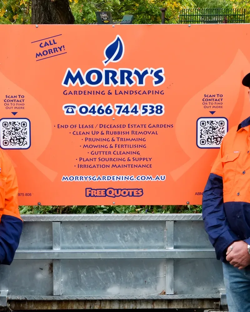 The orange Morry's trailer sign with the phone number 0466 744 538 and Free Quotes